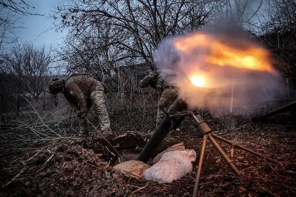 In this photo taken on March 16, 2025 and provided by Ukraine's 24th Mechanized Brigade press service, Ukrainian soldiers fire 120mm mortar towards Russian army positions near Chasiv Yar, Donetsk region, Ukraine, Sunday, March 16, 2025. (Oleg Petrasiuk/Ukraine's 24th Mechanized Brigade via AP)