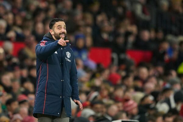 Manchester United's head coach Ruben Amorim gives instructions to his players during the English Premier League soccer match between Manchester United and Ipswich Town at the Old Trafford stadium in Manchester, England, Wednesday, Feb. 26, 2025. (AP Photo/Dave Thompson)