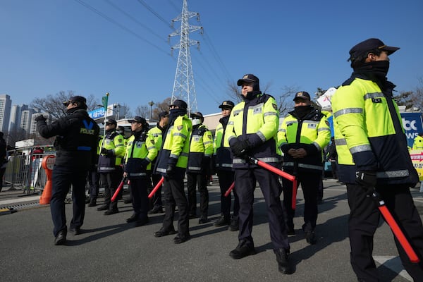 Police officers stand guard outside of a detention center where Yoon is sent in Uiwang, South Korea, Friday, Jan. 17, 2025. (AP Photo/Lee Jin-man)