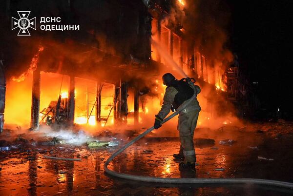 In this photo provided by the Ukrainian Emergency Service, firefighters put out the fire at a storehouse following a Russian attack in Odesa, Ukraine, Friday, March 21, 2025. (Ukrainian Emergency Service via AP)