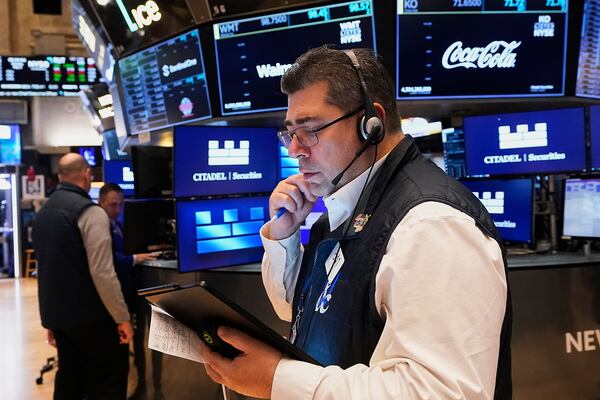 Trader Michael Capolino works on the floor of the New York Stock Exchange, Monday, May 5, 2025. (AP Photo/Richard Drew)