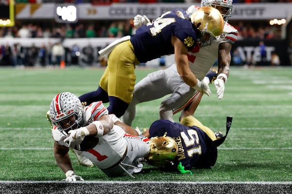 Ohio State running back Quinshon Judkins scores against Notre Dame during first half of the College Football Playoff national championship game Monday, Jan. 20, 2025, in Atlanta. (AP Photo/Butch Dill)