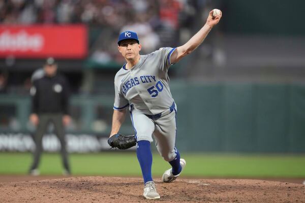 Kansas City Royals pitcher Kris Bubic (50) throws against the San Francisco Giants during the sixth inning of a baseball game in San Francisco, Monday, May 19, 2025. (AP Photo/Jeff Chiu)
