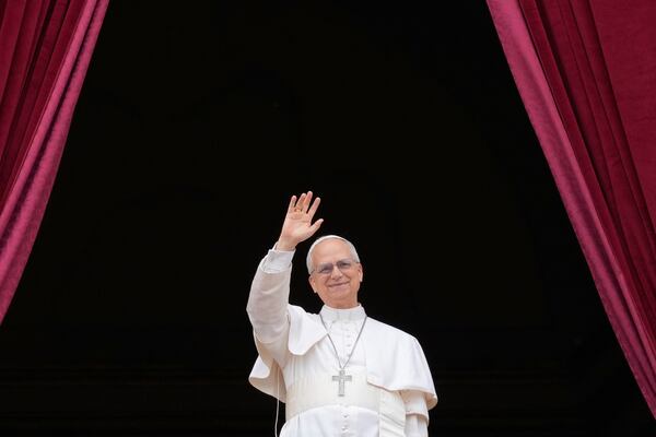 Pope Leo XIV appears on the central balcony of St. Peter's Basilica at the Vatican to bless the crowd below on May 11, 2025. (AP Photo/Gregorio Borgia)