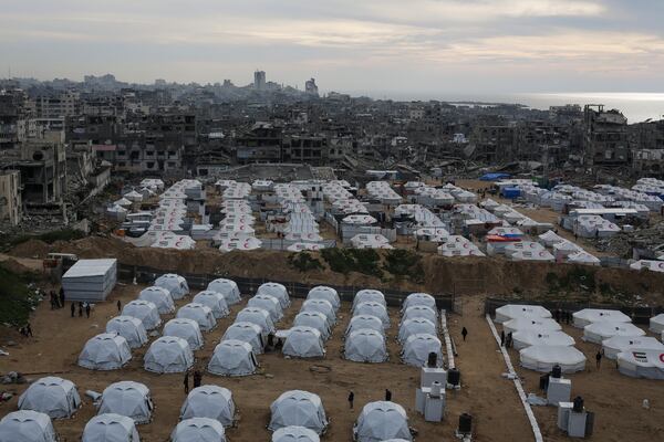 A tent camp for displaced Palestinians is set up amid destroyed buildings in the west of Al-Shati camp, west of Gaza City, on Monday, March 3, 2025. (AP Photo/Jehad Alshrafi)