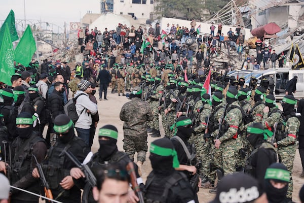 Hamas fighters are deployed in central Gaza City ahead of the planned release of four Israeli female hostages set to be handed over to the Red Cross in Gaza City on Saturday, Jan. 25, 2025. (AP Photo/Abed Hajjar)