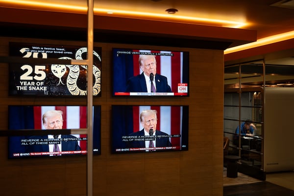 The inauguration of U.S. President Donald Trump plays live on screens in the lobby of a building in Halifax, Nova Scotia, on Monday, Jan. 20, 2025. (Darren Calabrese/The Canadian Press via AP)