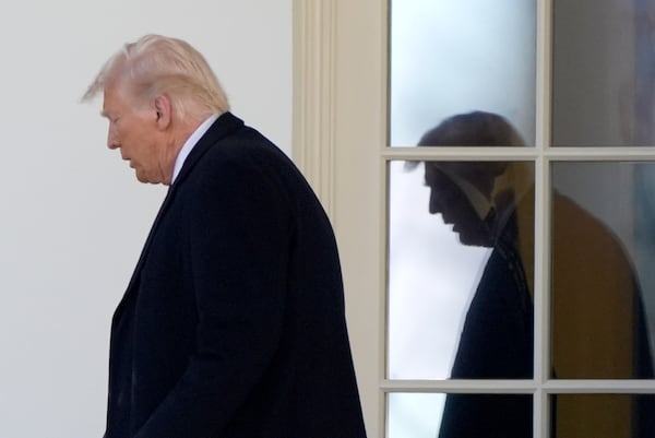 President Donald Trump walks from the Oval Office to board Marine One as he departs from the South Lawn of the White House, Friday, Feb. 14, 2025, in Washington. (AP Photo/Alex Brandon)