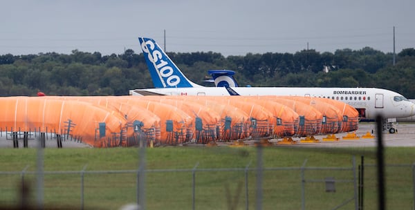 FILE - In this Oct. 3, 2019, photo completed Boeing 737 MAX fuselages, made at Spirit Aerosystems in Wichita, Kan., sit covered in tarps near the factory. (Travis Heying/The Wichita Eagle via AP, File)