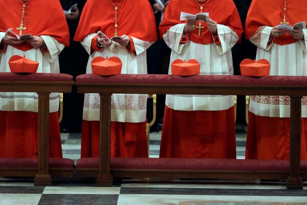 FILE-- Cardinals attend vespers with Pope Francis at St. Peter and Paul's Basilica in Rome, Wednesday, Jan. 25, 2017. (AP Photo/Gregorio Borgia)