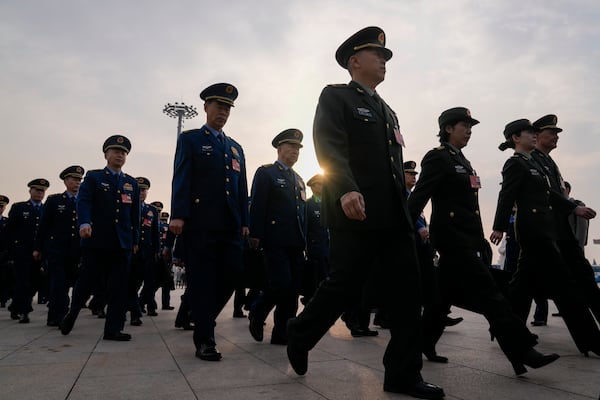 Military delegates march ahead of the opening session of the National People's Congress (NPC) at the Great Hall of the People in Beijing, China, Wednesday, March 5, 2025. (AP Photo/Andy Wong)