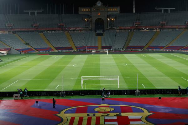 Empty stands and field seen after the cancellation of the Spanish La Liga soccer match between Barcelona and Osasuna, at the Lluis Companys Olympic Stadium, in Barcelona, Spain, Saturday, March 8, 2025. (AP Photo/Joan Monfort)