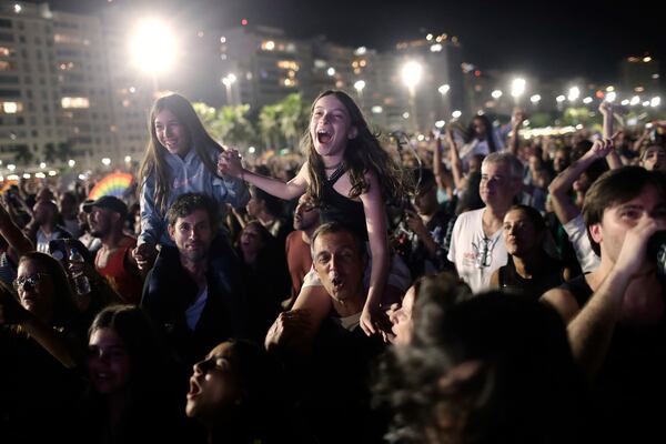 Fans cheer as they watch Lady Gaga free concert on Copacabana beach, in Rio de Janeiro, Sunday, May 4, 2025. (AP Photo/Bruna Prado)